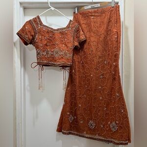 Elegant orange beaded lehenga skirt with blouse and dupatta